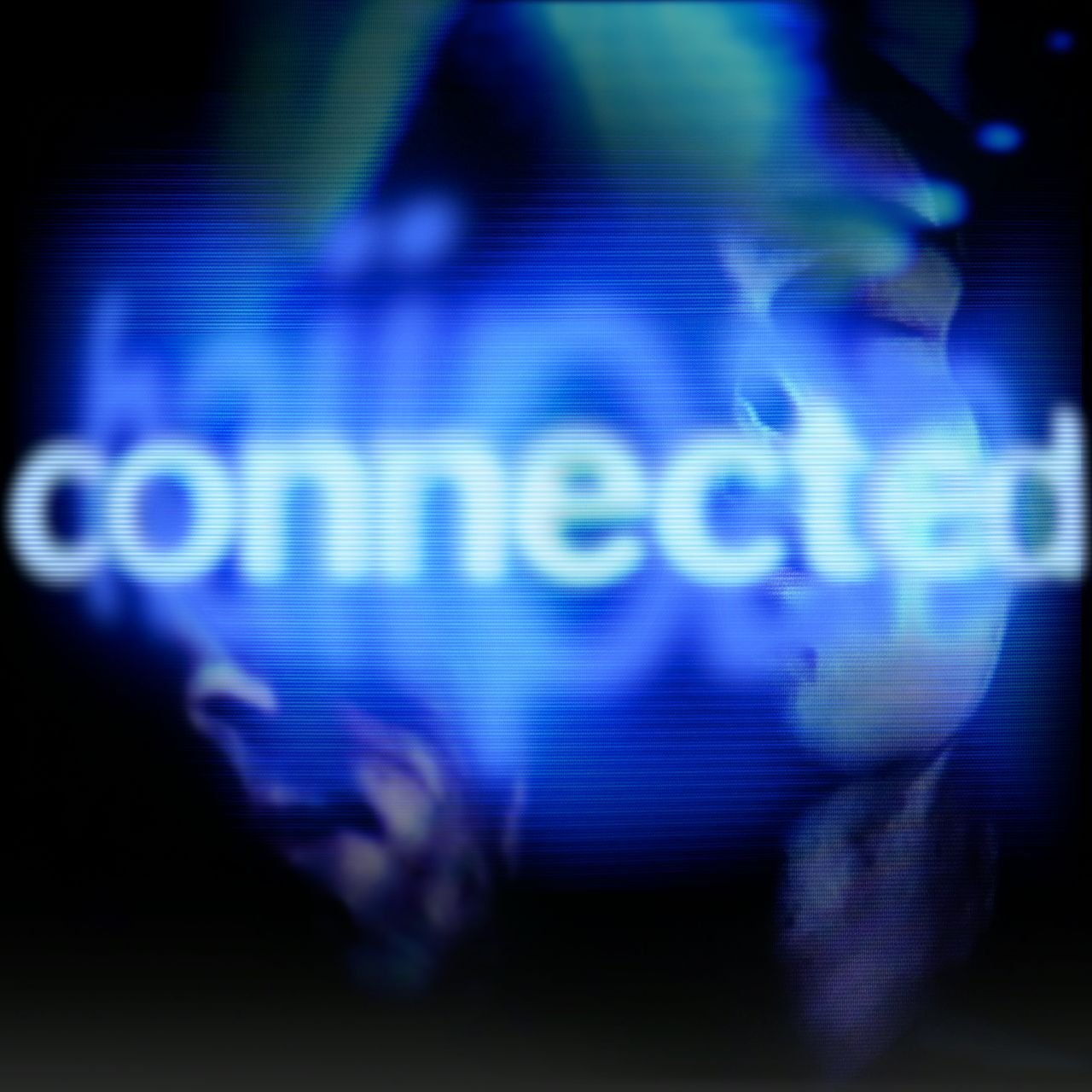 Glowing text that reads 'connected'. The face of the artist appears in the background.