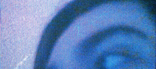 Blue monochrome image of the artist
